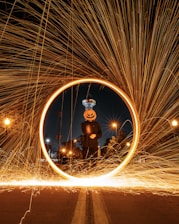 man in black jacket and brown pants standing on brown steel wool