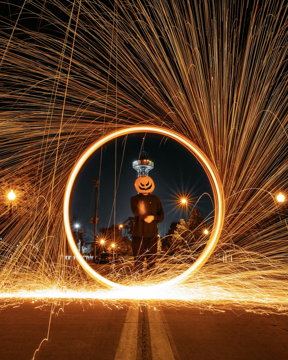 man in black jacket and brown pants standing on brown steel wool