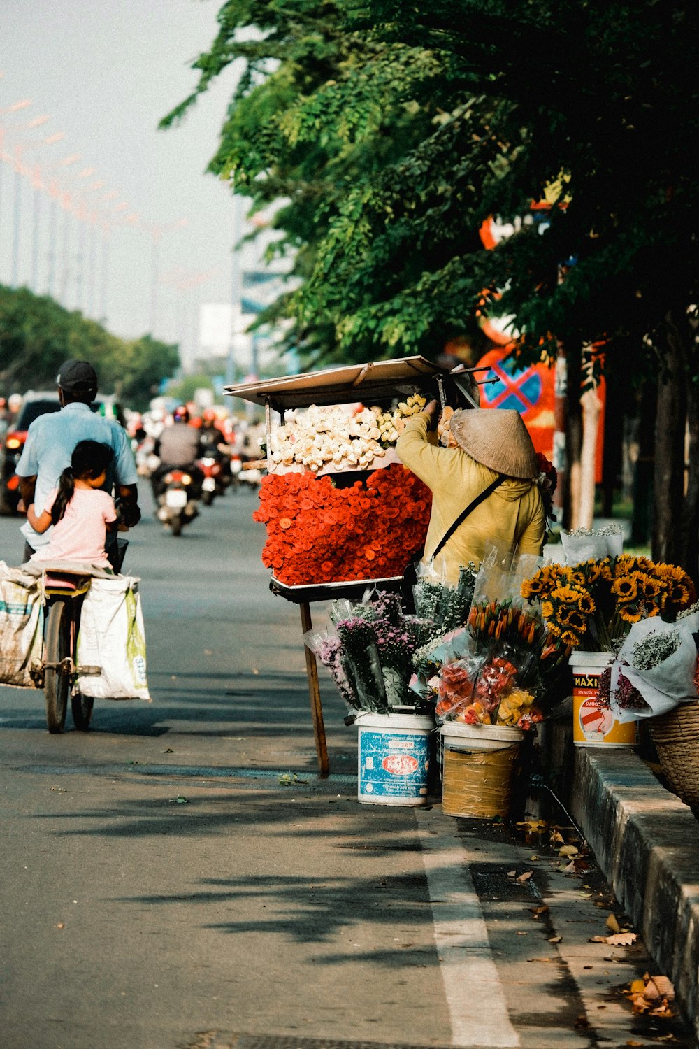 man in brown jacket and blue denim jeans riding on bicycle with fruits in basket