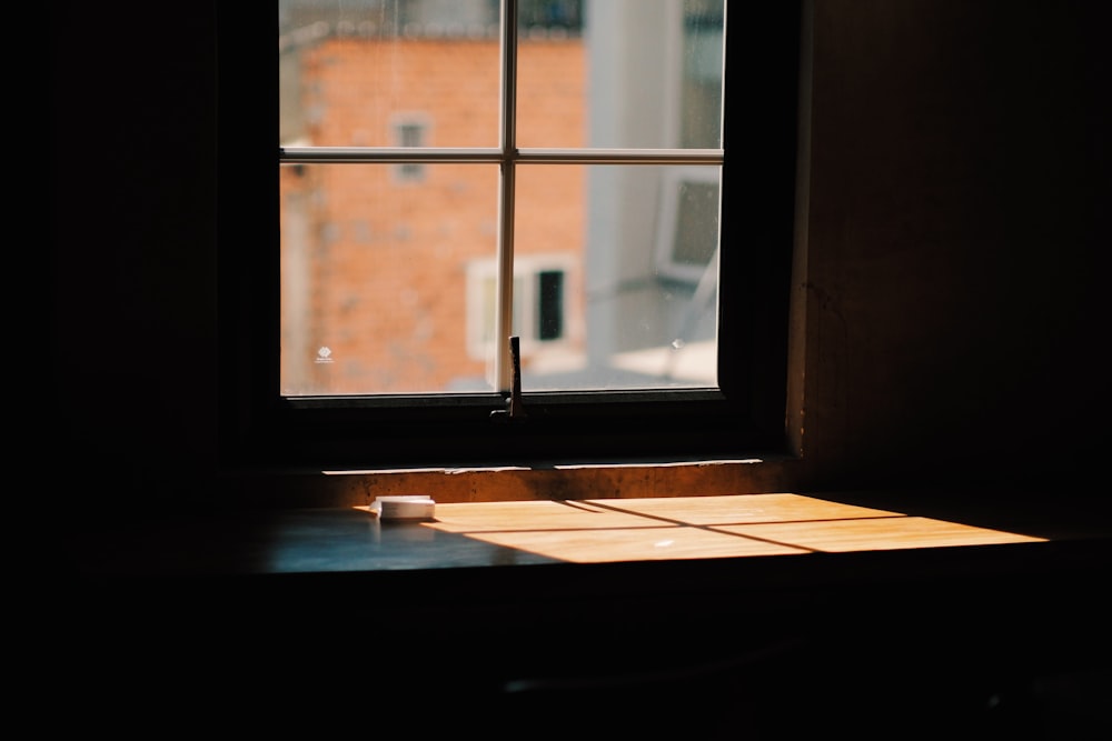 white wooden framed glass window