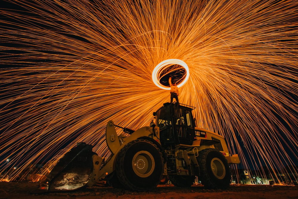 man riding tractor on fire