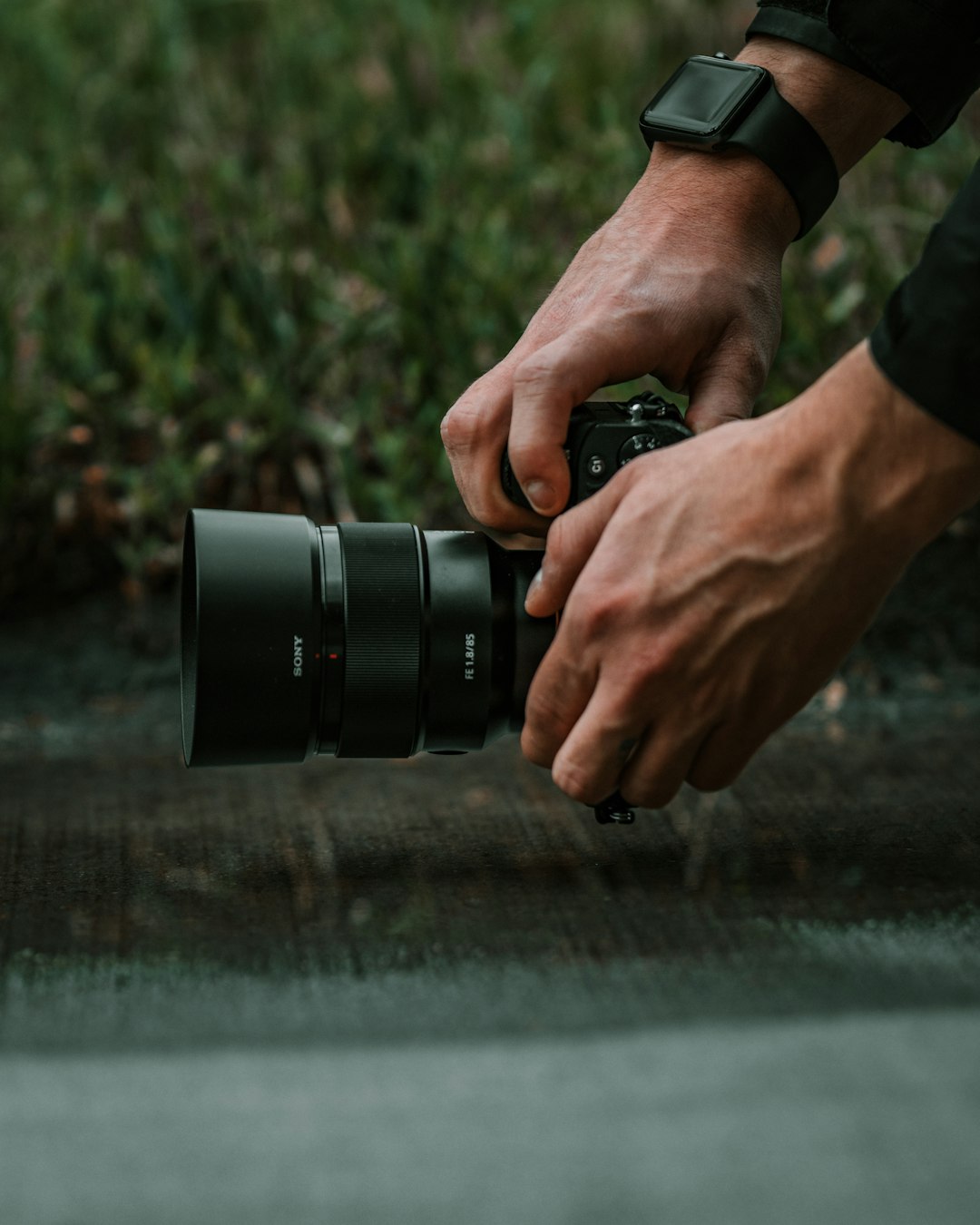 person holding black dslr camera