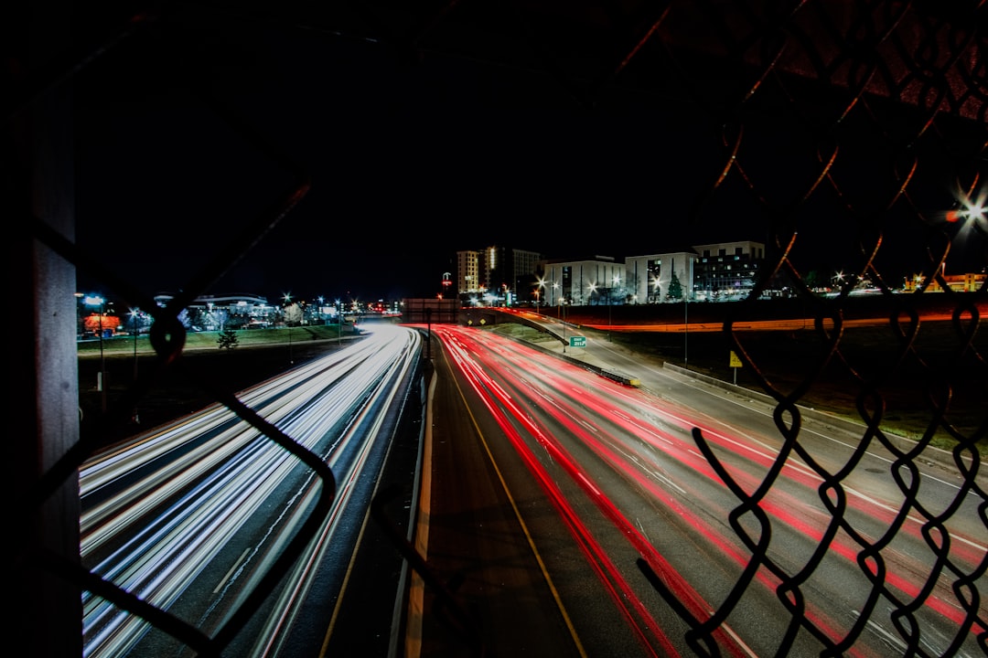 time lapse photography of cars on road during night time