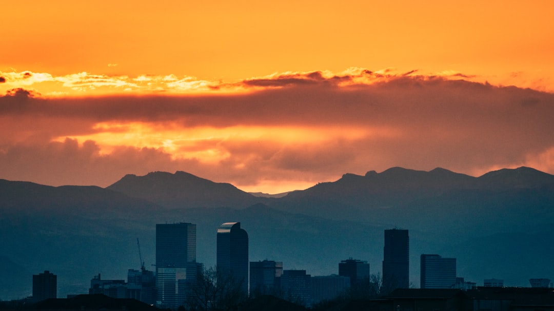 silhouette of city buildings during sunset