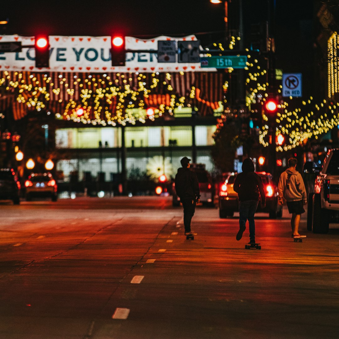 people walking on pedestrian lane during night time