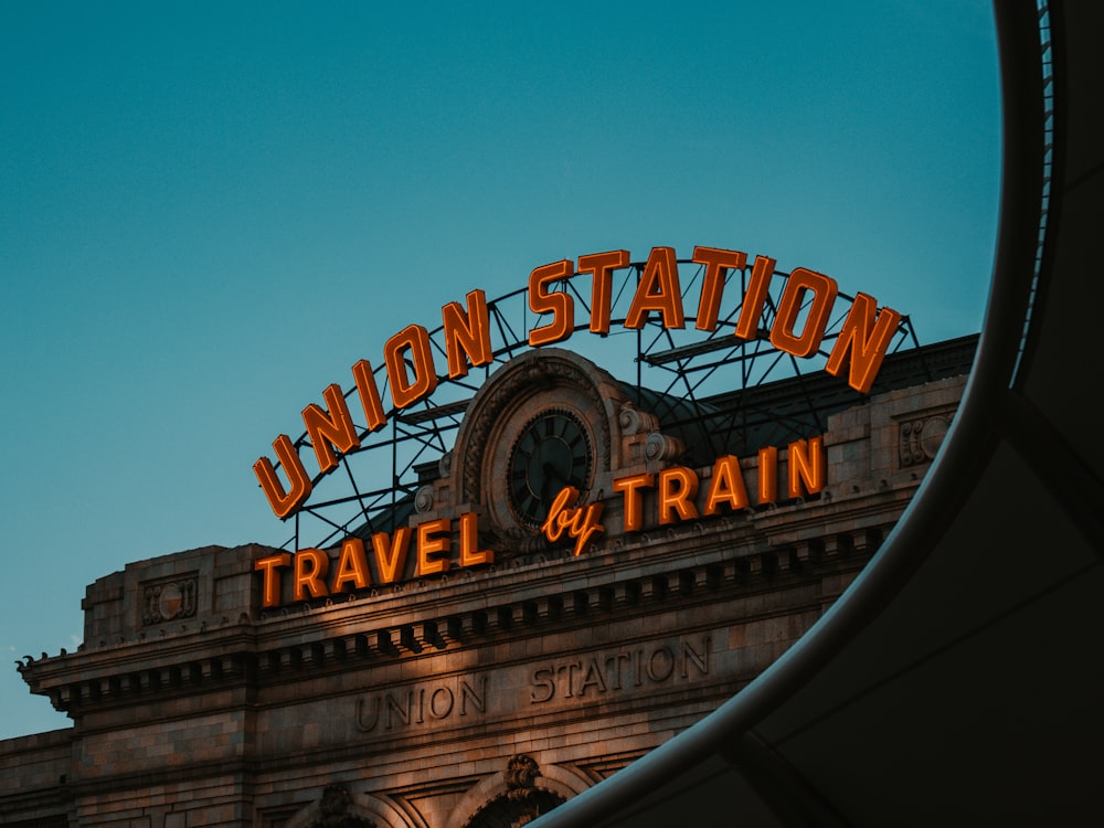 a train station with a neon sign that reads union station