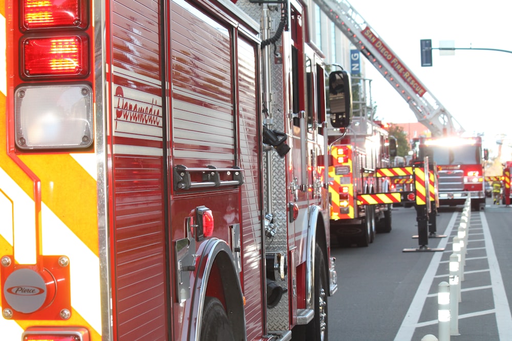 red and white fire truck on road during daytime