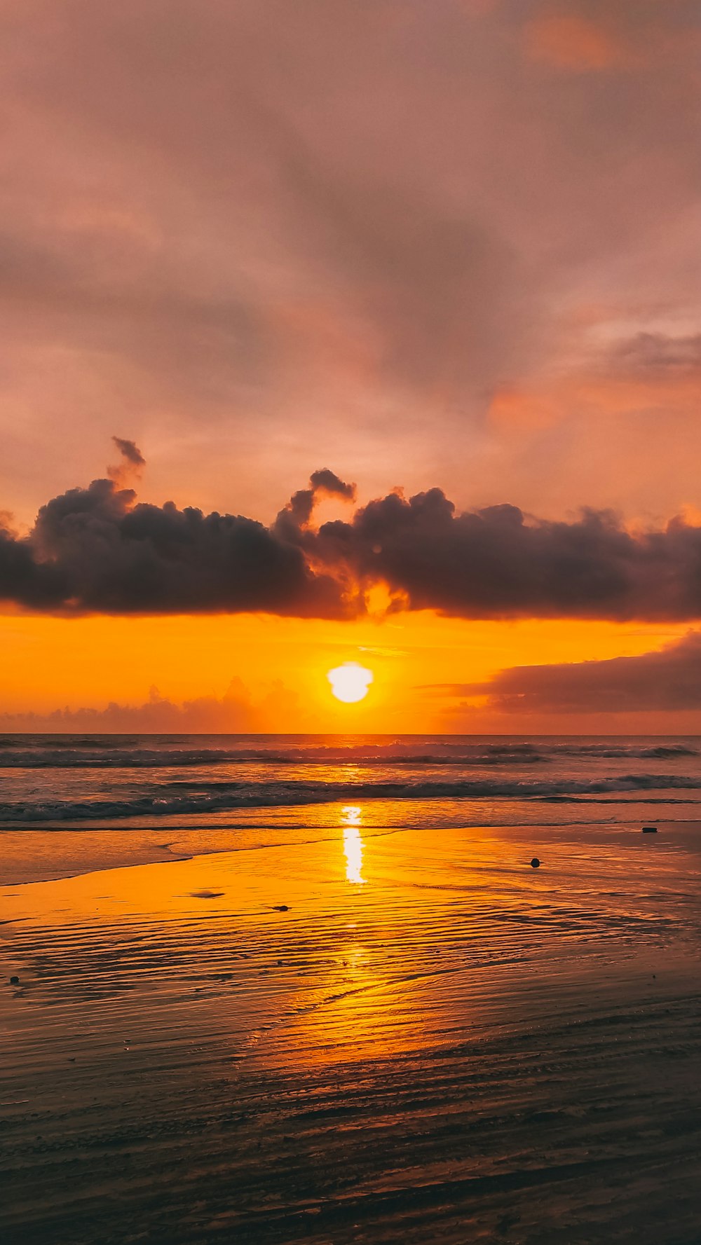 body of water during sunset