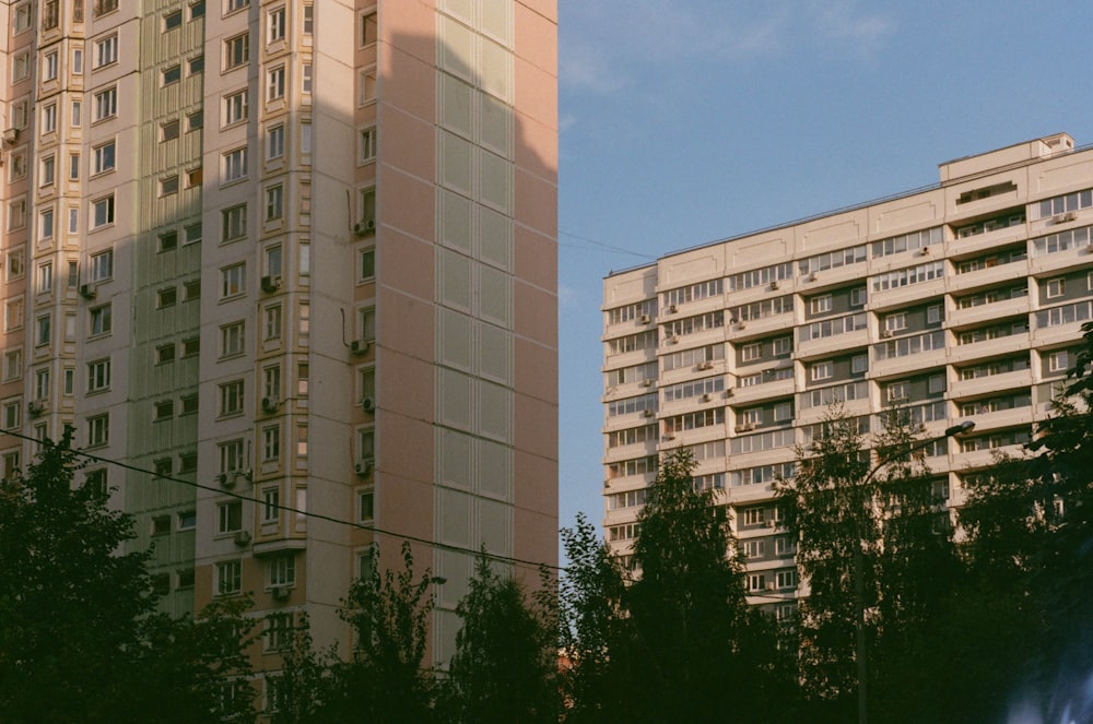 white concrete building near trees during daytime