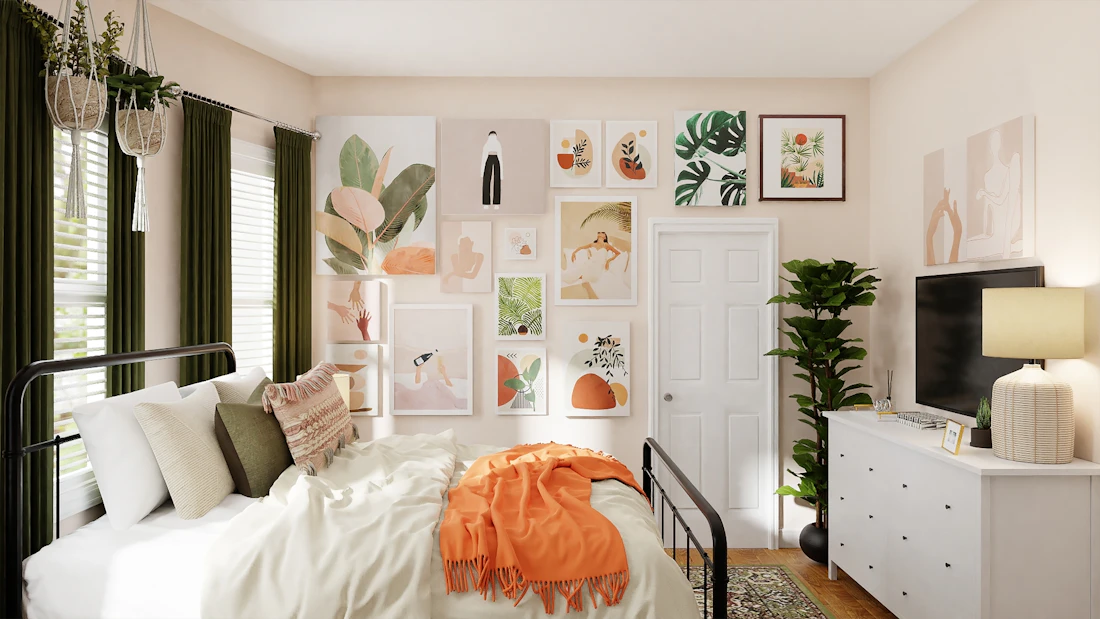 A warm student residence room with a black metal bed frame, white bedding, a rust-coloured throw, a framed art gallery wall, green curtains and a dresser with a soft lamp