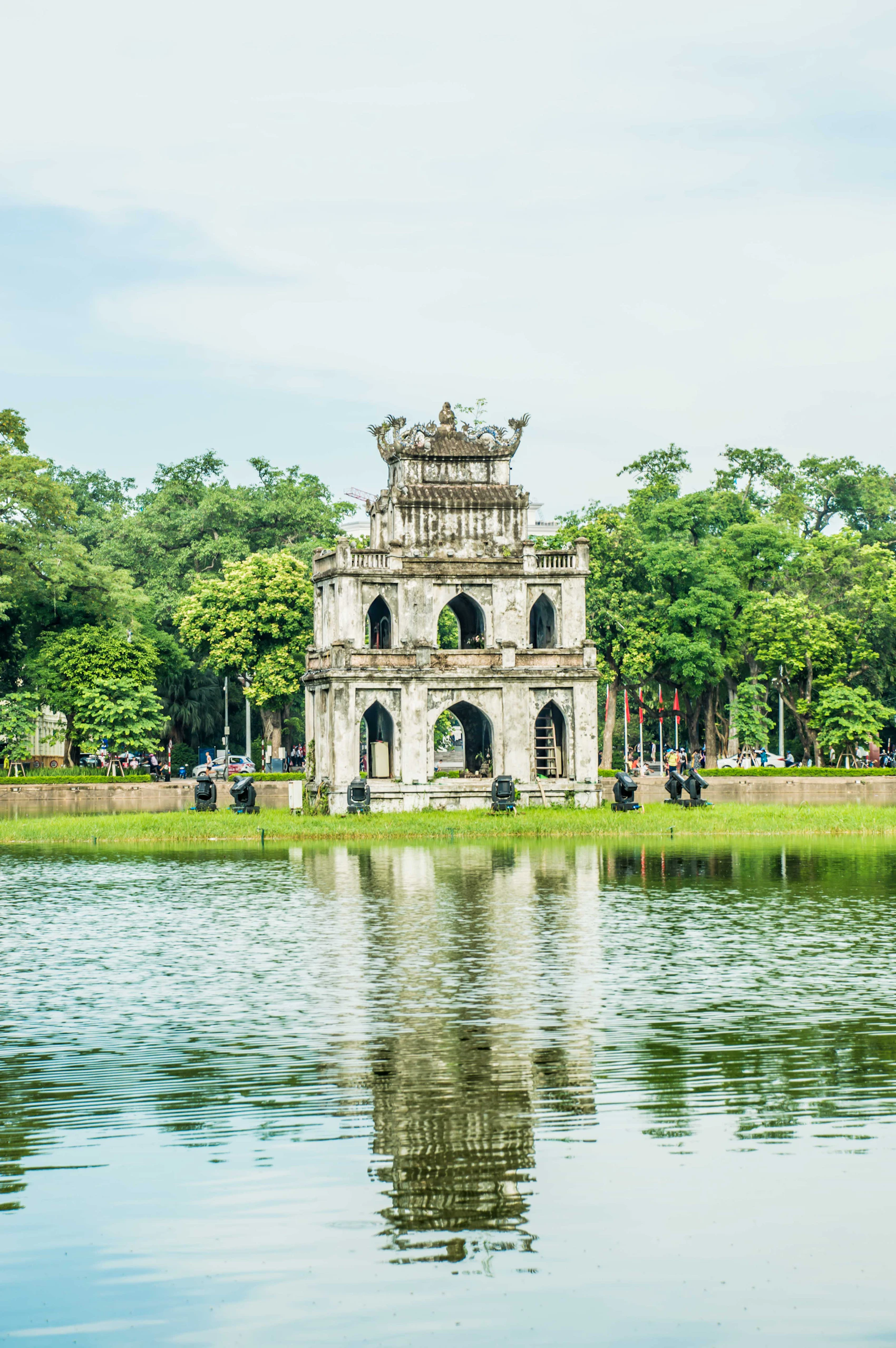 Turtle Tower standing in Hoàn Kiếm Lake among trees in central Hanoi