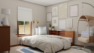 A serene, stylish bedroom featuring warm beige tones and subtle gold accents.