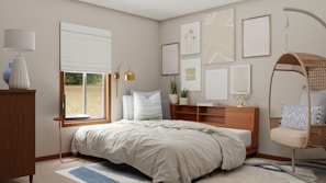 A cozy bedroom styled with neutral tones and contemporary decor