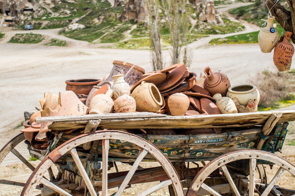 brown wooden carriage with brown leather shoes on top