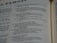 Pages of an open book featuring text in English. The text includes sections that seem to be from a literary or religious text, focusing on poetic or narrative forms.