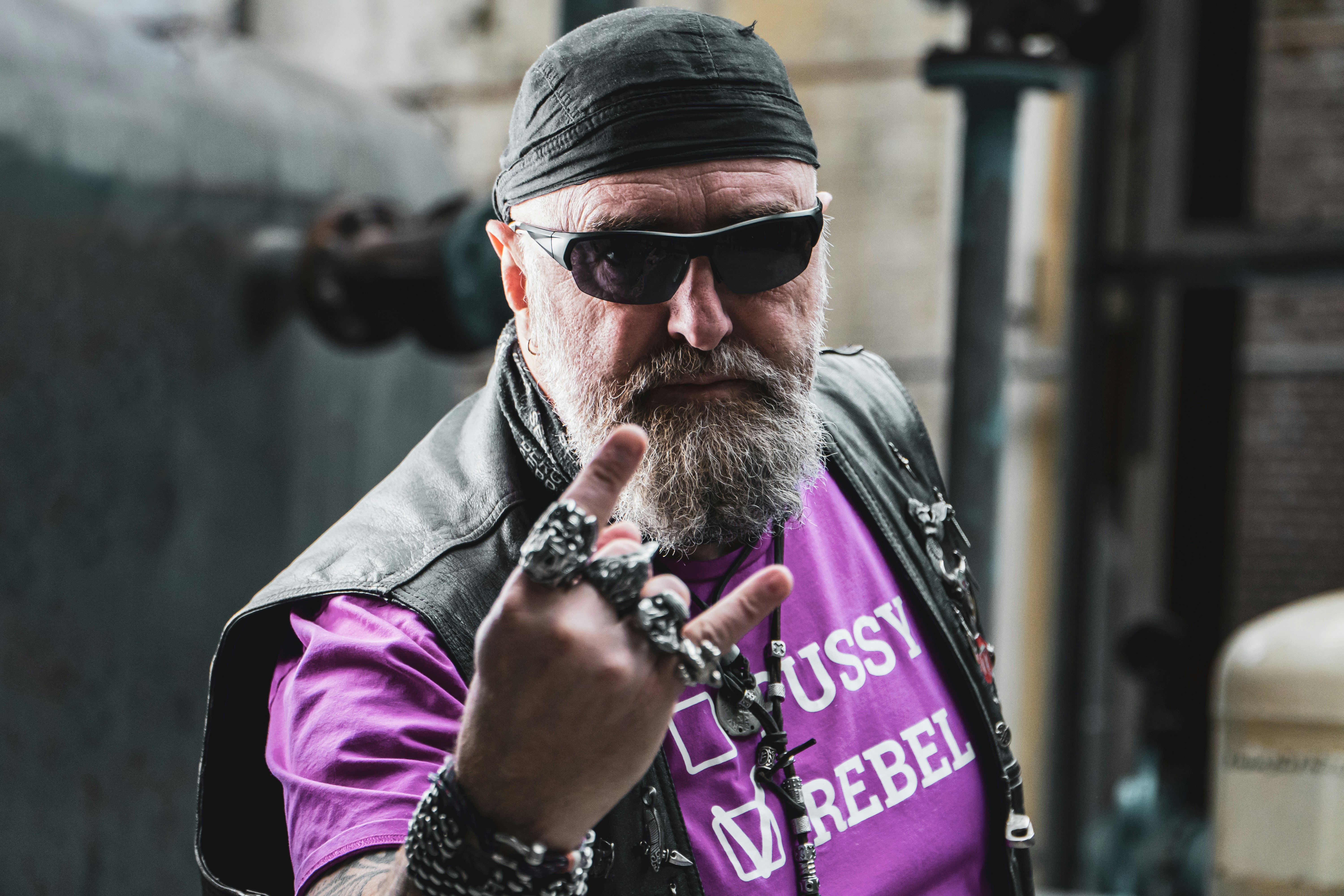 man in gray knit cap and purple jacket