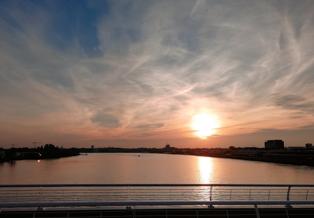 A serene image of the Triveni Sangam at sunset, symbolizing unity and spirituality.