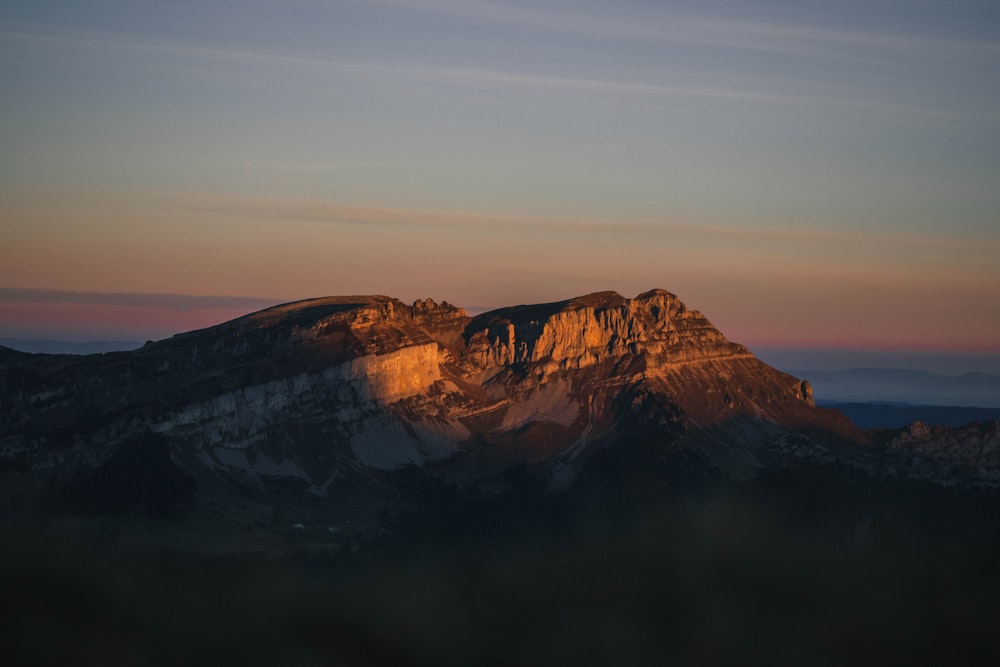 brown and black mountain under white sky during daytime