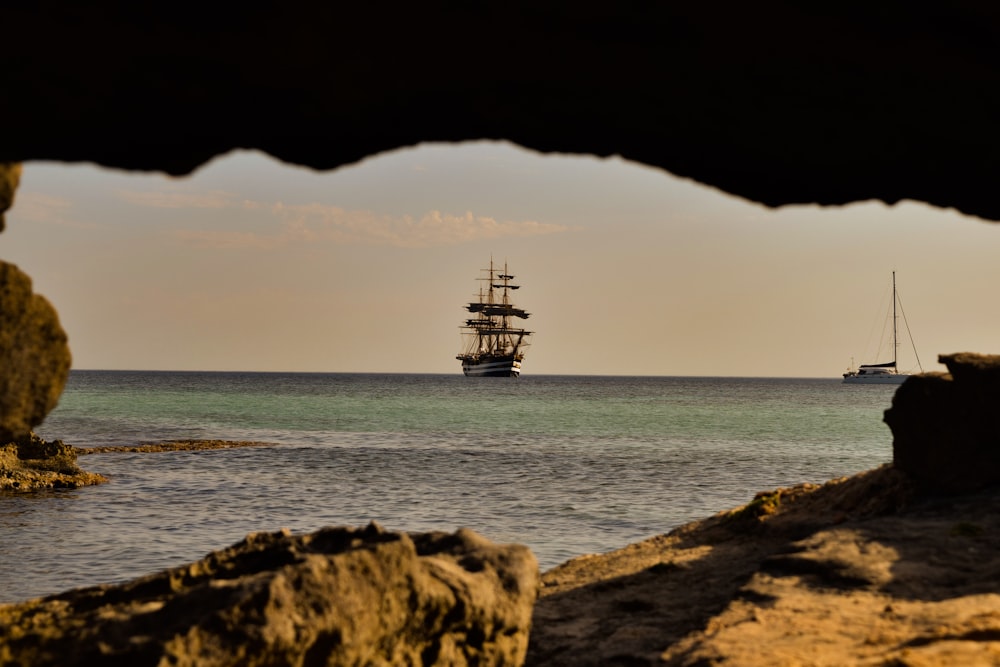 brown rock formation on sea during daytime