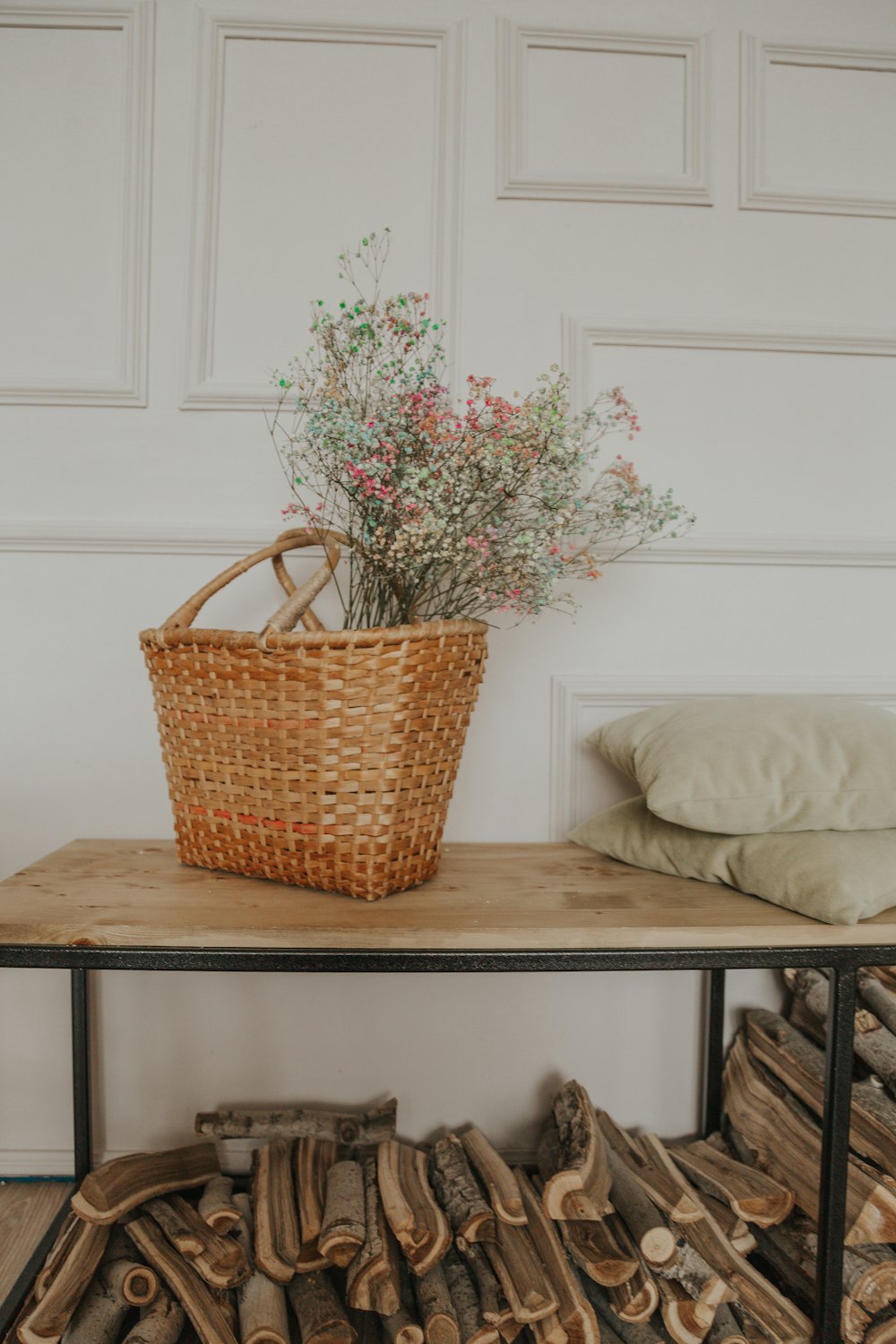 brown woven basket on white wooden table