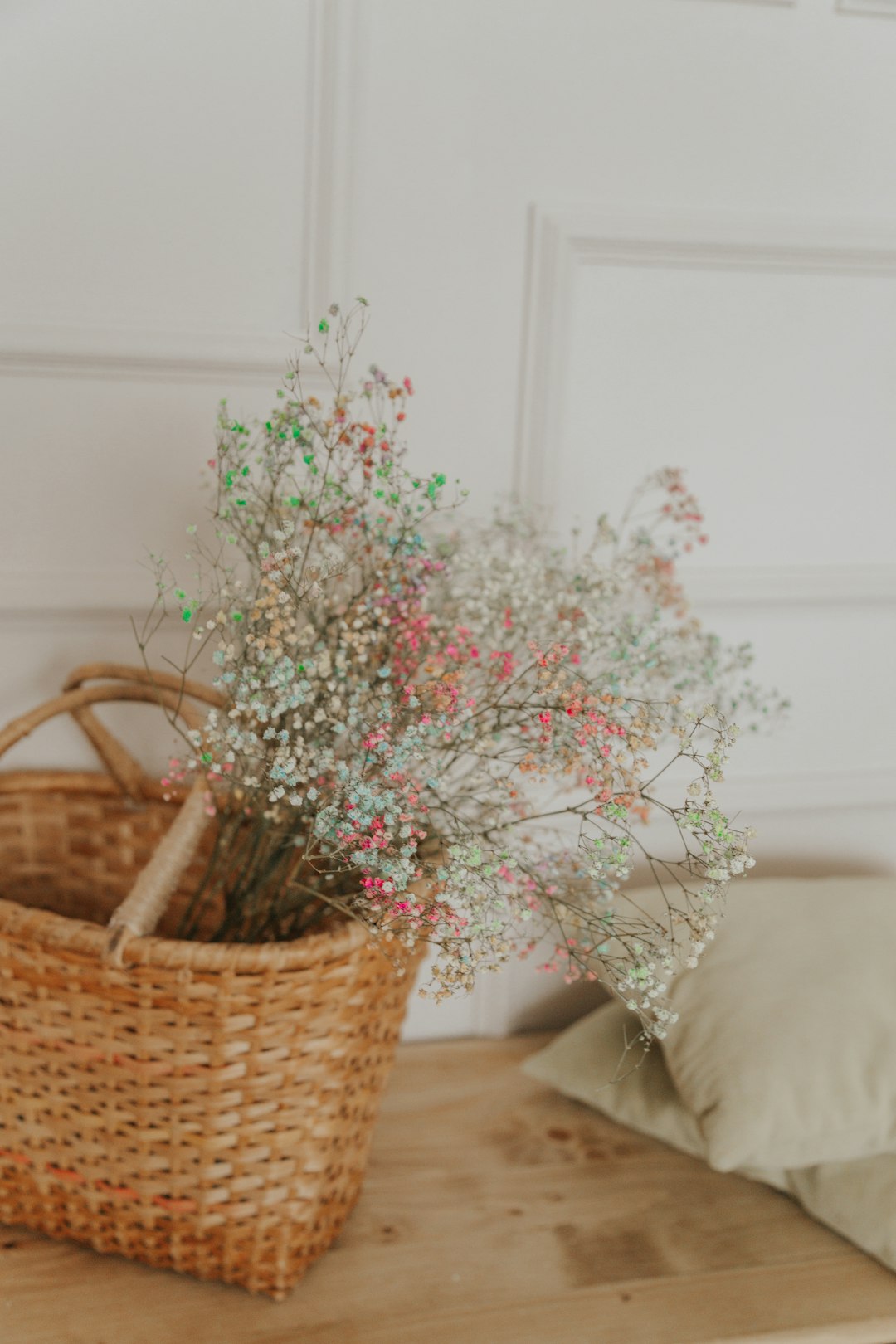 green and pink plant on brown woven basket