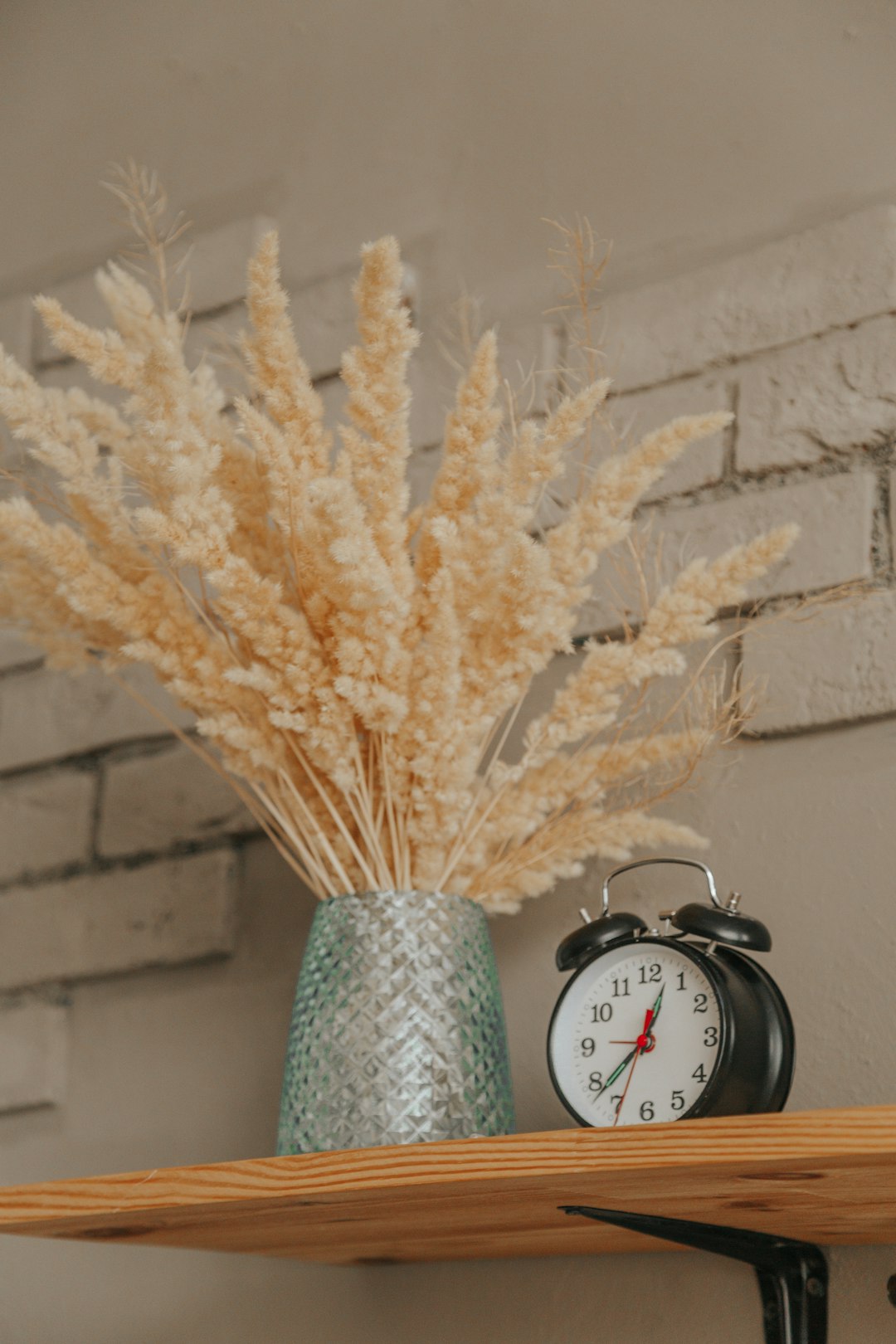 white and silver round analog wall clock