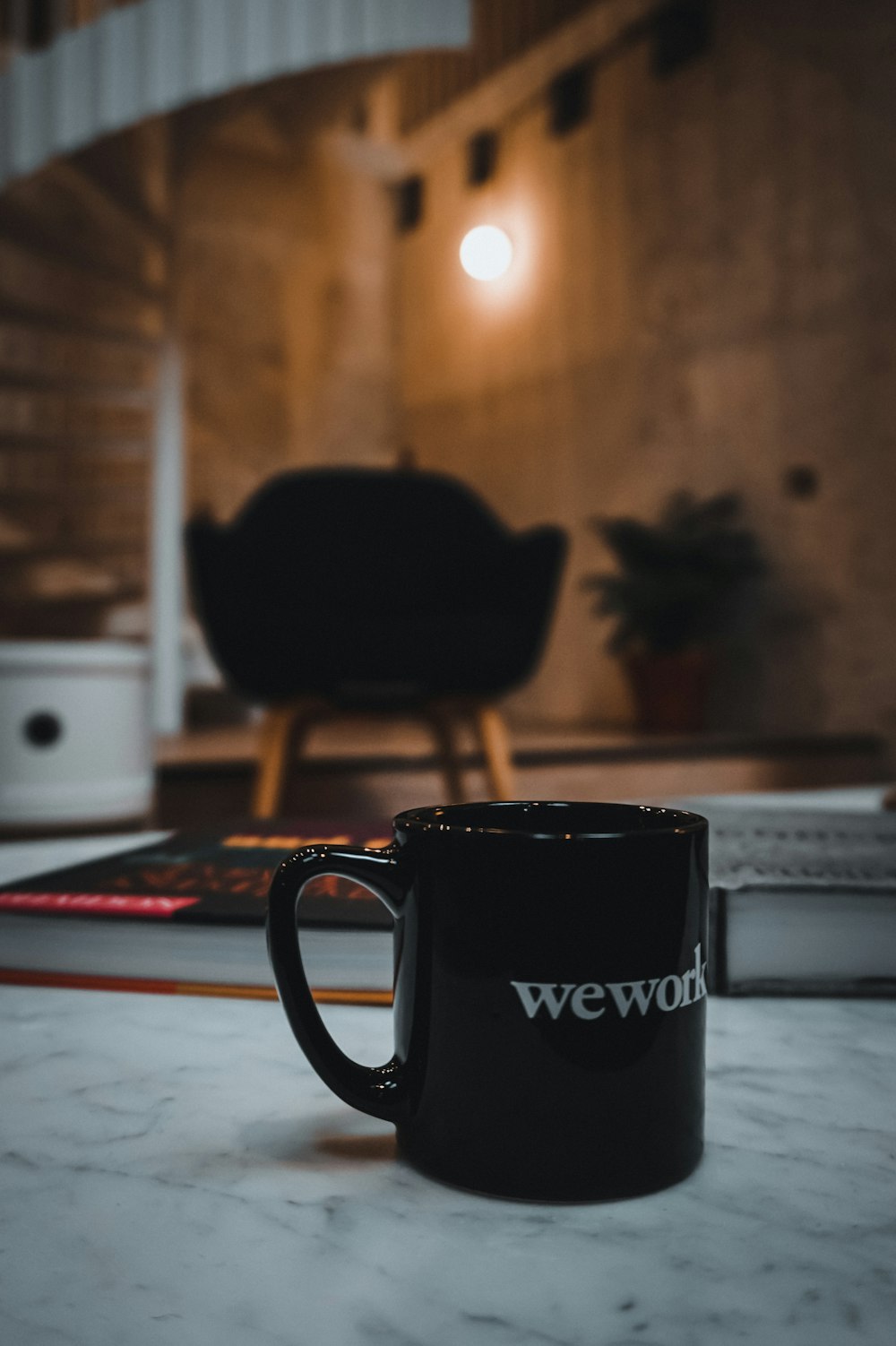 black and white ceramic mug on white table