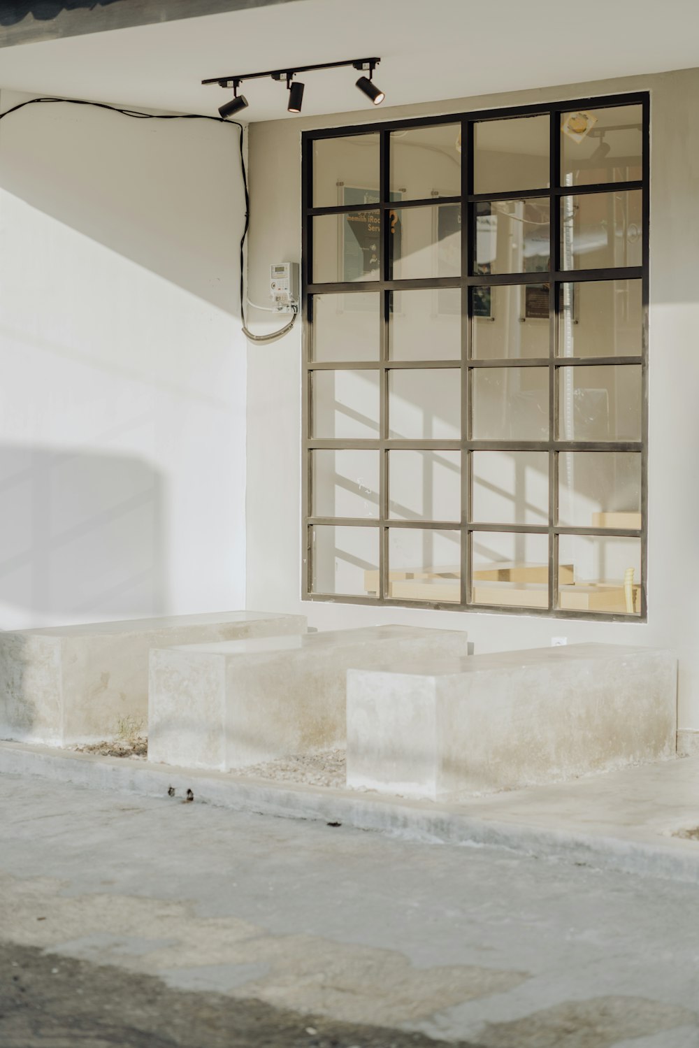 white concrete building with brown wooden window