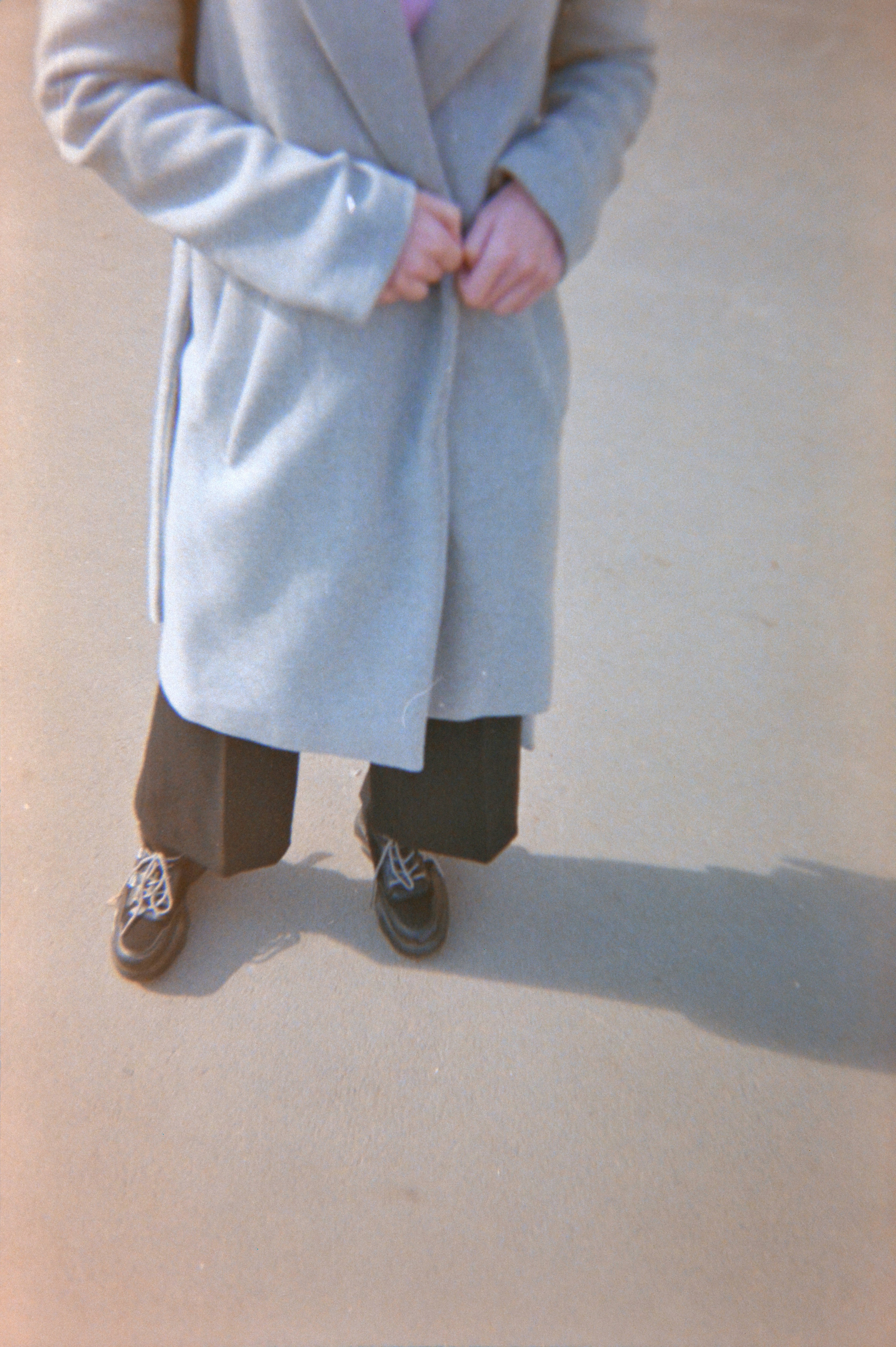 person in gray pants and black shoes