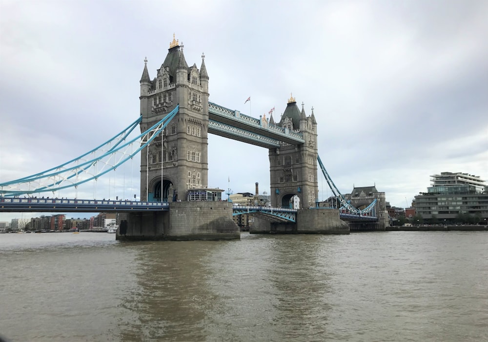 gray concrete bridge over river during daytime