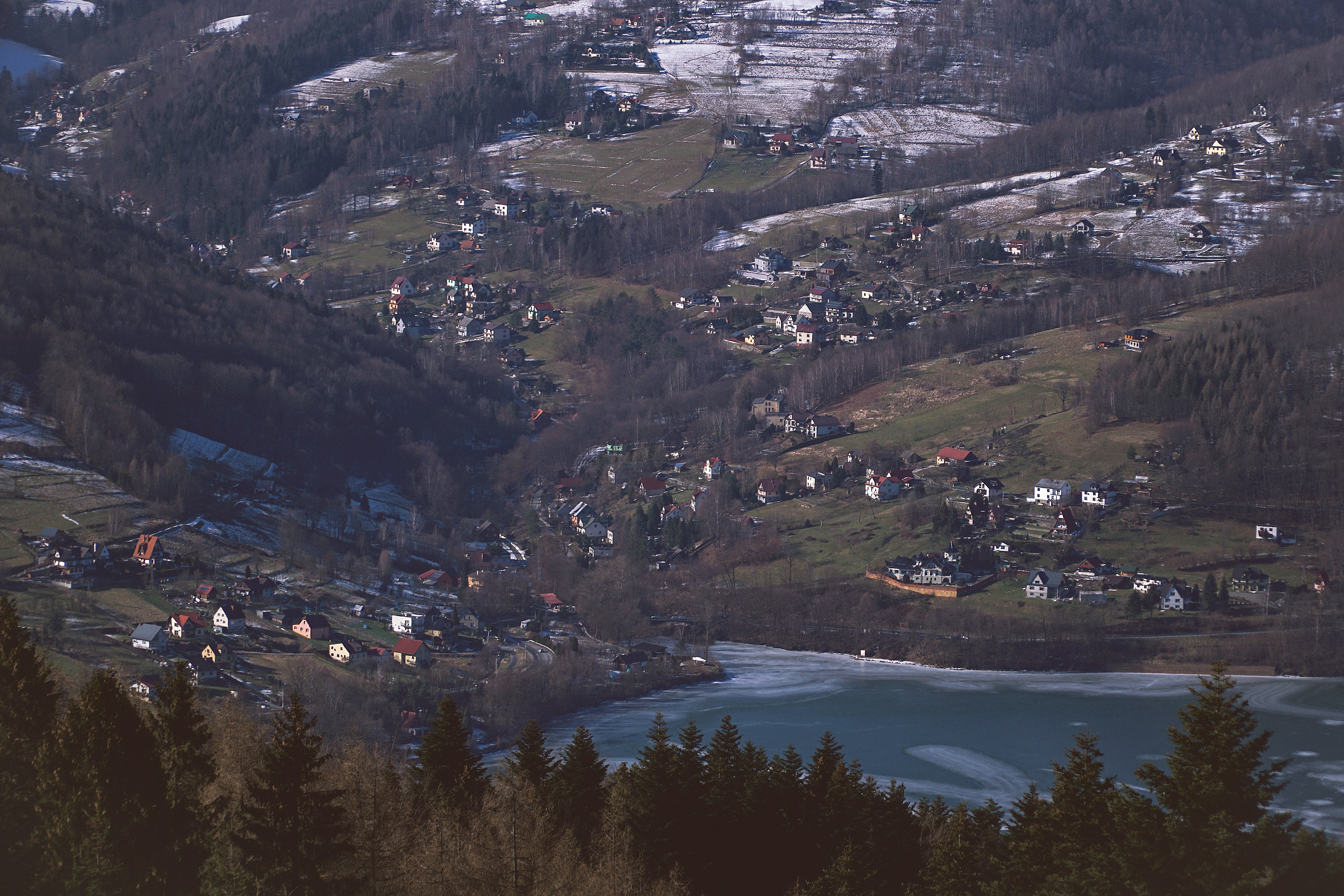 aerial view of city near lake during daytime