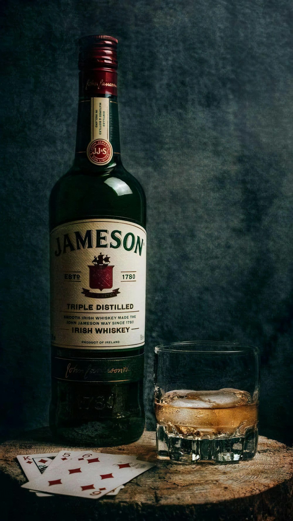 a bottle of jameson next to a glass of whiskey