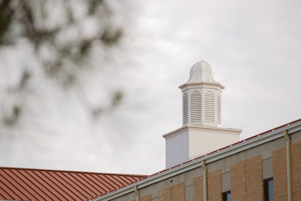 white and brown concrete building under white sky during daytime