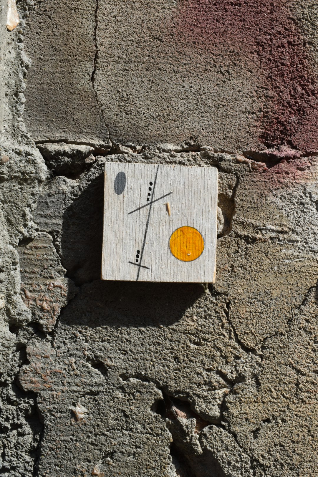 brown wooden board with yellow round ornament