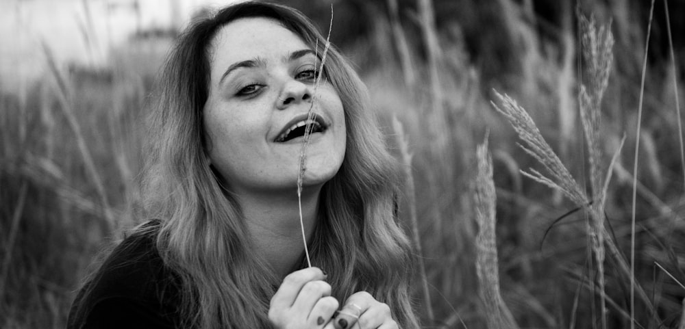 grayscale photo of girl with white earbuds