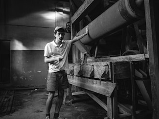 The factory floor with machines and workers crafting personalized caps