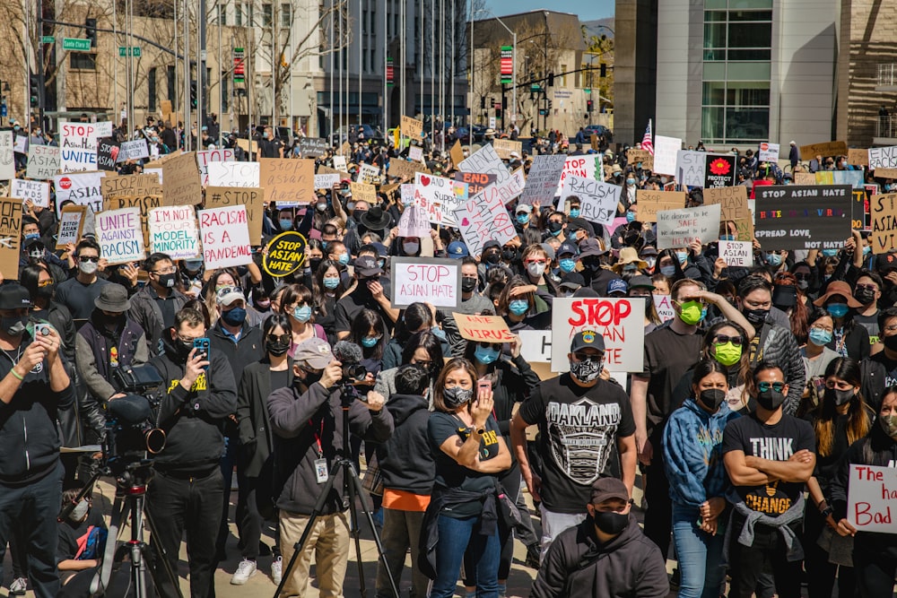 group of people standing on street during daytime