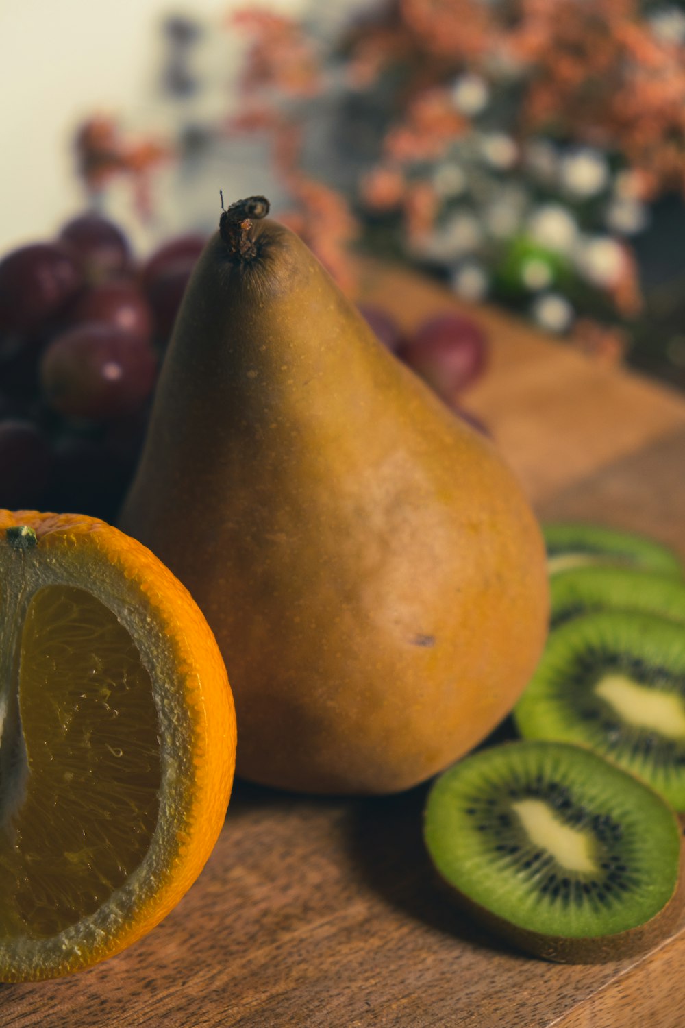 sliced orange fruit on brown wooden table