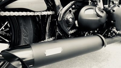 Close-up of motorcycle parts and tools on a workbench.