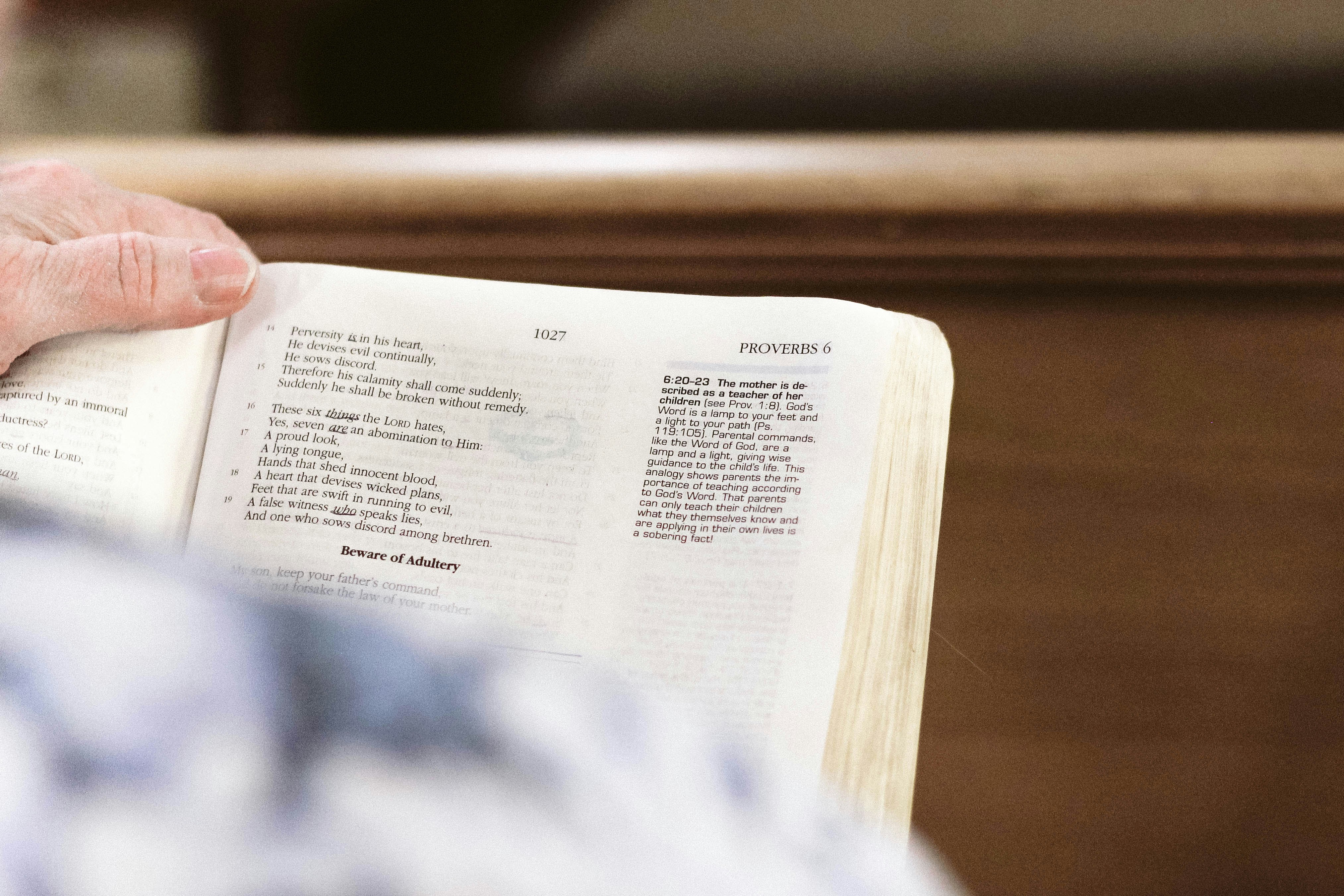 person holding white printer paper