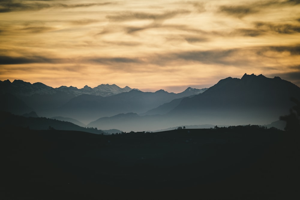 silhouette of mountains during sunset