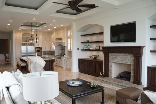 A cozy living room warmly lit with modern appliances blending into the comfortable space.