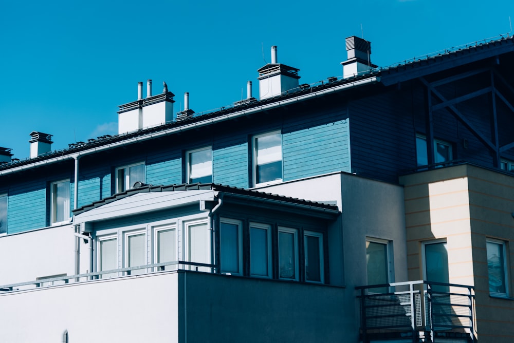 white and blue concrete building under blue sky during daytime