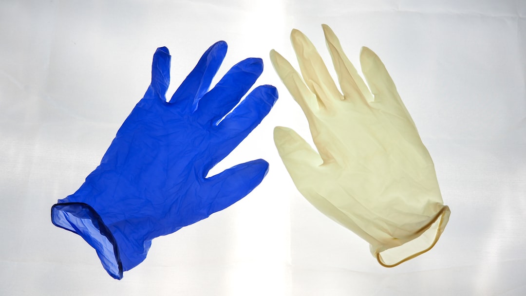 blue gloves on white surface,