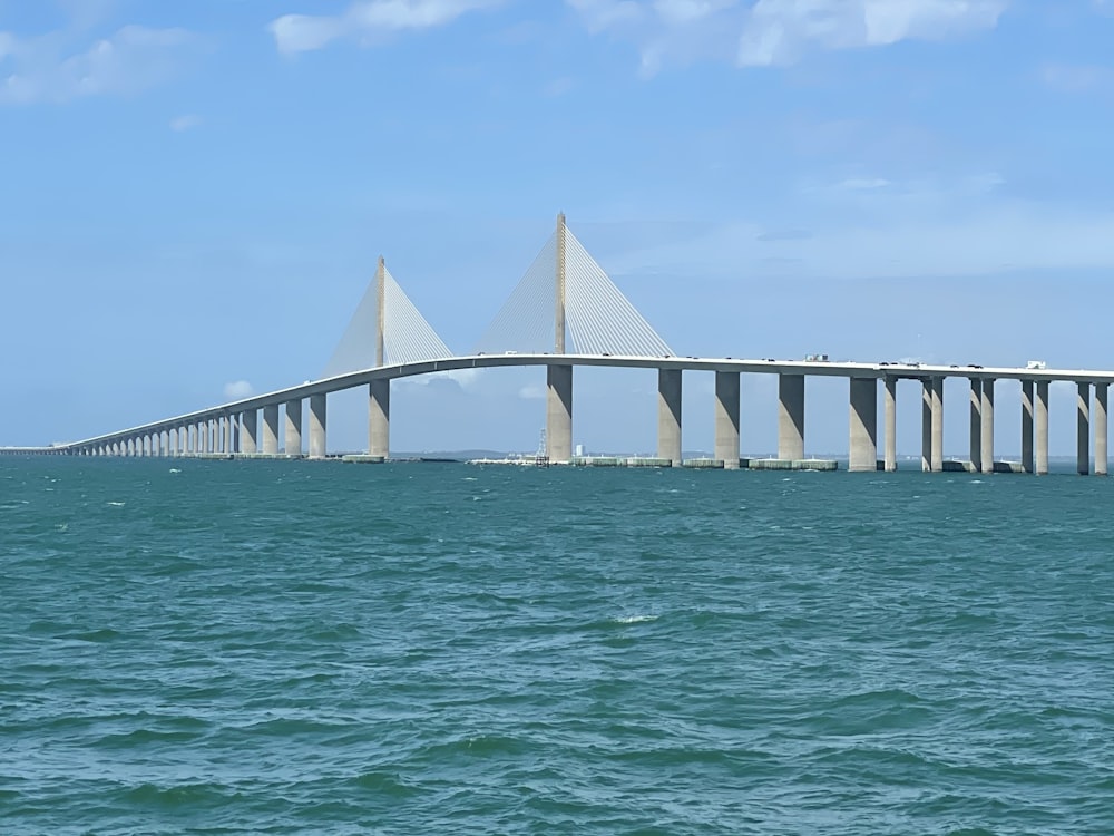 white concrete bridge over water during daytime