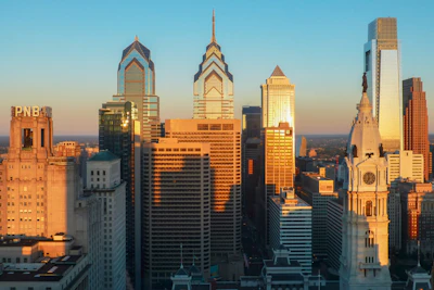 The Philadelphia skyline lit gold at sunset