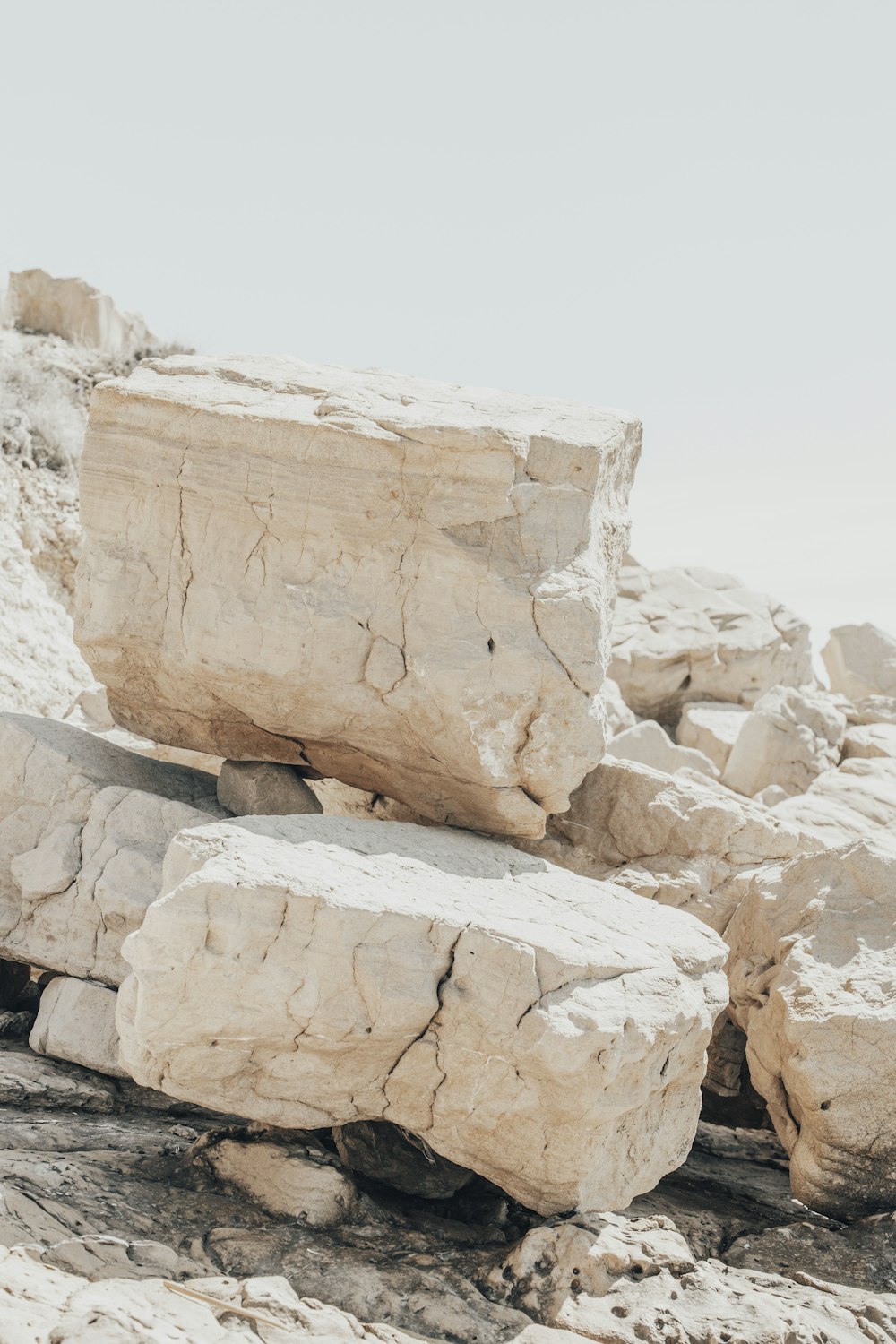 brown rock formation under white sky during daytime