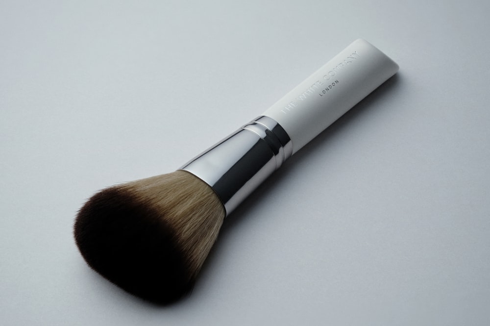 white and black makeup brush