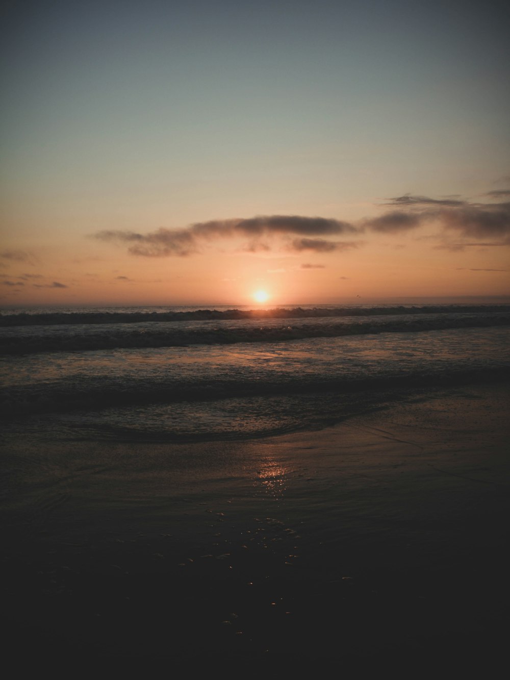 body of water during sunset