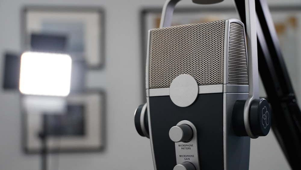 silver and black headphones on white table